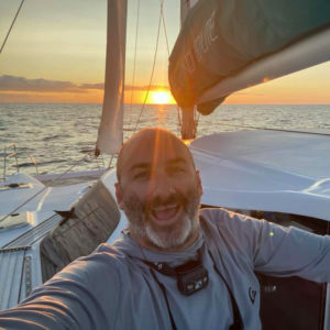 captain shawn with sunset on a boat
